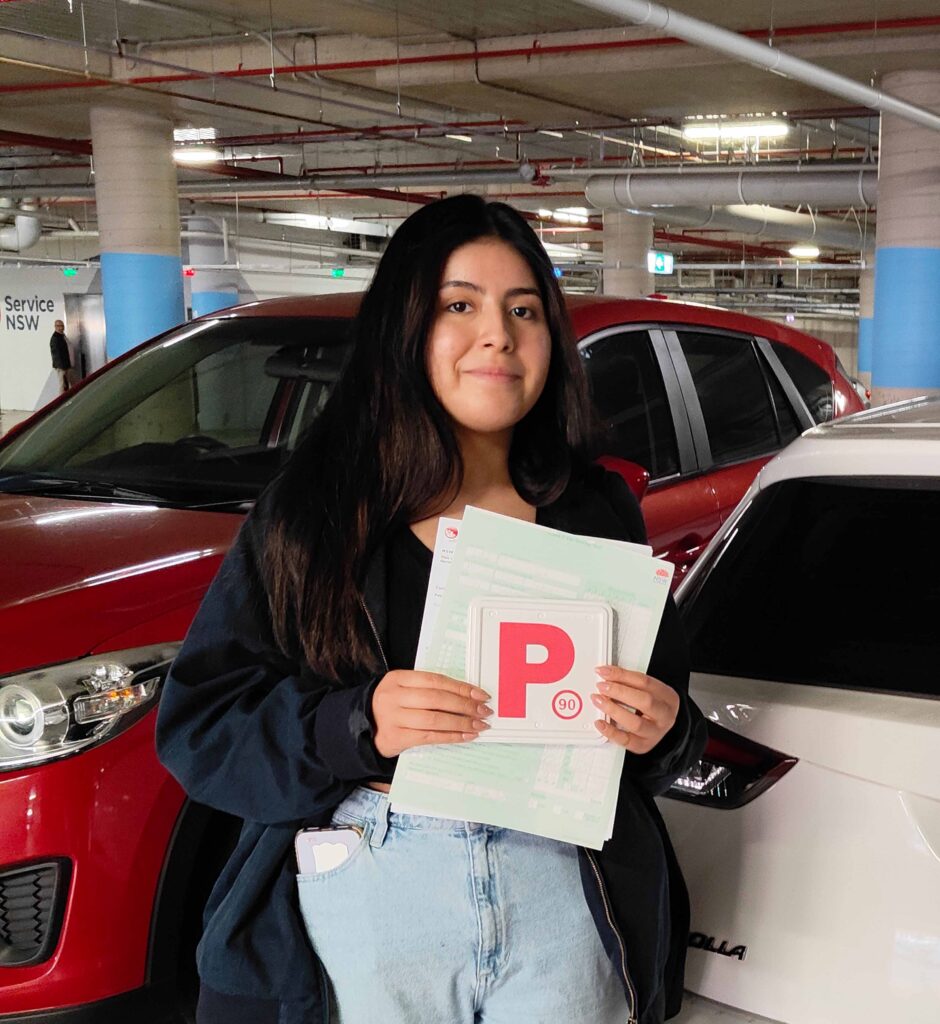Nervous learner driver smiling after a successful driving lesson in Liverpool
